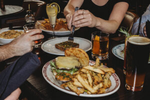 photograph of a busy dinner table at The Avery