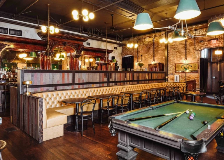 Inside photo of a classic hotel, with tables covered in linen
