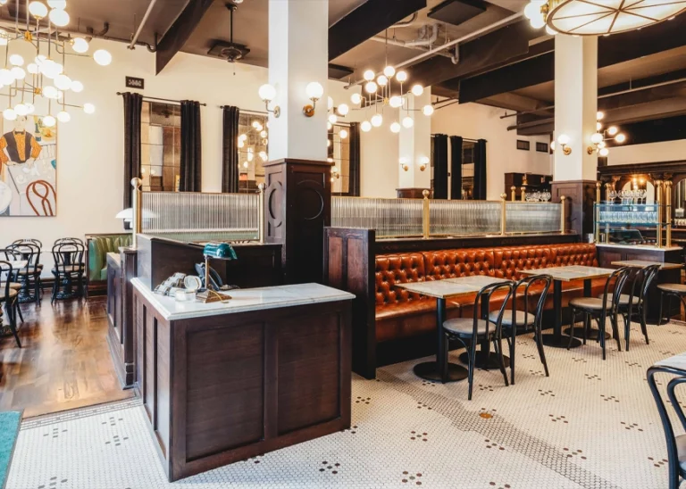 Classy room of a restaurant w/ brown leather seating