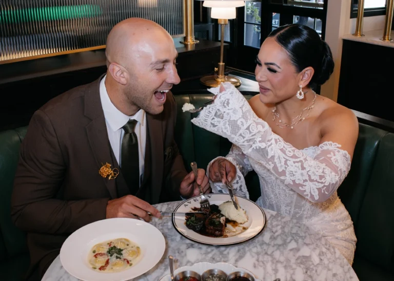 Bride and groom sharing a Michelin-star meal